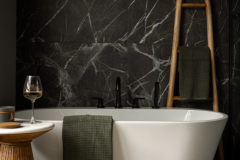 Luxurious bathtub area with dark tile